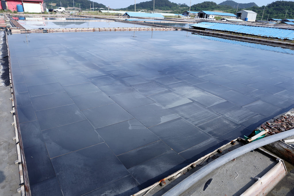 Black ceramic drying beds on the salt farm